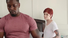 Redhead babe wraps her lips around a big black cock